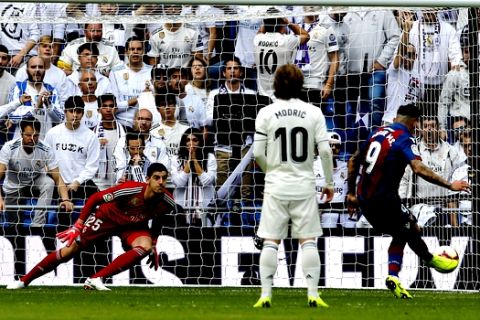 Levante's Roger Marti, right,scores a penalty during a Spanish La Liga soccer match between Real Madrid and Levante at the Santiago Bernabeu stadium in Madrid, Spain, Saturday, Oct. 20, 2018. (AP Photo/Paul White)
