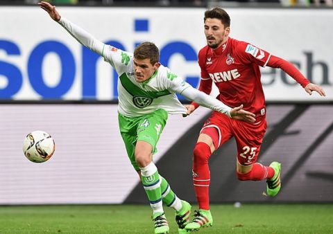 WOLFSBURG, GERMANY - JANUARY 31:  Sebastian Jung of VfL Wolfsburg is pulled back by Filip Mladenovic of Cologne during the Bundesliga match between VfL Wolfsburg and 1. FC Koeln at Volkswagen Arena on January 31, 2016 in Wolfsburg, Germany.  (Photo by Stuart Franklin/Bongarts/Getty Images)