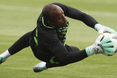 Nigeria goalkeeper Ikechukwu Ezenwa cathes the ball during Nigeria's official training on the eve of the group D match between Croatia and Nigeria at the 2018 soccer World Cup in the Kaliningrad Stadium in Kaliningrad, Russia, Friday, June 15, 2018. (AP Photo/Czarek Sokowski)