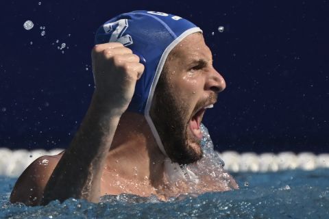 Konstantinos Genidounias of Greece reacts after scored a goal during the Men's water polo semifinal match between Italy and Greece at the 19th FINA World Championships in Budapest, Hungary, Friday, July 1, 2022. (AP Photo/Anna Szilagyi)
