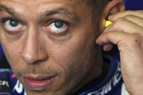 Italy's  MotoGP driver Valentino Rossi of the  Movistar Yamaha MotoGP Team, waits during the second free practice at Sachsenring circuit in Hohenstein-Ernstthal, Germany, Friday, June 30, 2017 ahead of the German Grand Prix on Sunday, July 2.  (Hendrik Schmidt/dpa via AP)