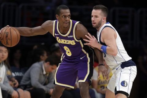 Los Angeles Lakers guard Rajon Rondo (9) is defended by Dallas Mavericks guard J.J. Barea during the first half of an NBA basketball game Wednesday, Oct. 31, 2018, in Los Angeles. (AP Photo/Marcio Jose Sanchez)