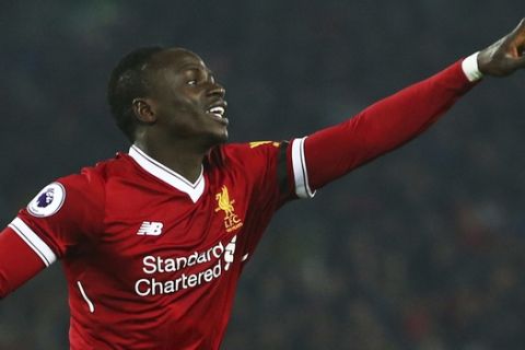 Liverpool's Sadio Mane celebrates scoring his side's third goal during the English Premier League soccer match between Liverpool and Manchester City at Anfield Stadium, in Liverpool, England, Sunday Jan. 14, 2018. (AP Photo/Dave Thompson)