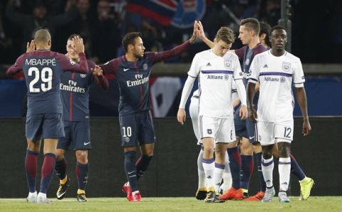 PSG players celebrate after scoring their first side's goal during a Champions League Group B soccer match between Paris Saint-Germain and Anderlecht at the Parc des Princes stadium in Paris, France, Tuesday, Oct. 31, 2017. (AP Photo/Christophe Ena)