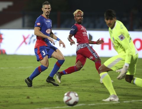 Gourav Mukhi, center, of Jamshedpur FC watches the ball after kicking it to score a goal against Bengaluru FC during the Hero Indian Super League (ISL) soccer match between Bengaluru FC and Jamshedpur FC in Bangalore, India, Sunday, Oct. 7, 2018. (AP Photo/Aijaz Rahi)