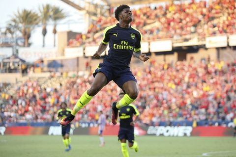 Arsenal's Chuba Akpom leaps after scoring gainst Chivas Guadalajara during the second half of a friendly soccer match in Carson, Calif., Sunday, July 31, 2016. (AP Photo/Danny Moloshok)
