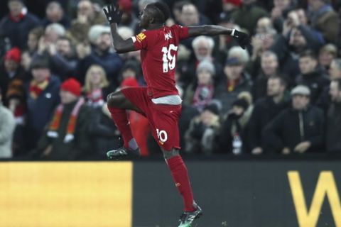 Liverpool's Sadio Mane celebrates after scoring his side's third goal during the English Premier League soccer match between Liverpool and Manchester City at Anfield stadium in Liverpool, England, Sunday, Nov. 10, 2019. (AP Photo/Jon Super)