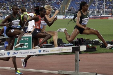 Kenya's Beatrice Chepkoech, right, leads the women's 3000m steeplechase during the Golden Gala, the first European meeting of the Diamond League, at the Rome Olympic Stadium, Thursday, May 31, 2018. (AP Photo/Gregorio Borgia)
