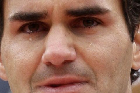 FILE - This is a June 7, 2009, file photo showing Switzerland's Roger Federer crying during the trophy ceremony, after defeating Sweden's Robin Soderling in their men's singles final match of the French Open tennis tournament, in Paris. Set aside, for the moment, Federer's athleticism and artistry, his sturdiness and strokes. Start instead with the pure numbers, simply because they serve as an objective, and overwhelming measure of his supremacy on a tennis court.  (AP Photo/Bernat Armangue, File)
