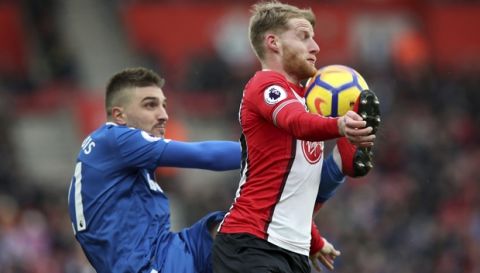 Stoke City's Kostas Stafylidis, left, and Southampton's Josh Sims in action during their English Premier League soccer match at St Mary's Stadium in Southampton, England, Saturday March 3, 2018. (Adam Davy/PA via AP)