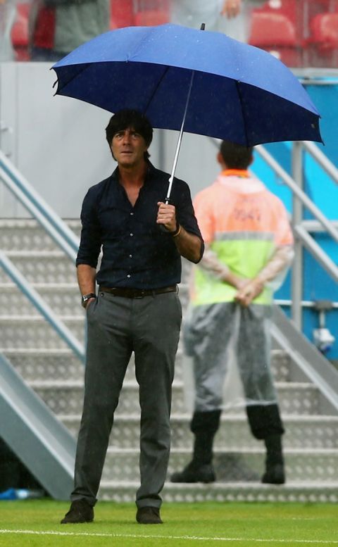 RECIFE, BRAZIL - JUNE 26: Head coach Joachim Loew of Germany looks on in the rain prior to the 2014 FIFA World Cup Brazil group G match between the United States and Germany at Arena Pernambuco on June 26, 2014 in Recife, Brazil.  (Photo by Martin Rose/Getty Images)