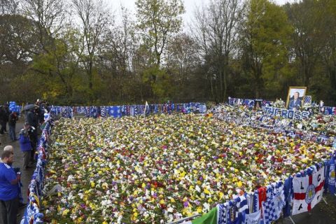 Floral tributes for those who lost their lives in the Leicester City helicopter crach including Leicester City Chairman Vichai Srivaddhanaprabha ahead of the Premier League match at the King Power Stadium, Leicester, England. Saturday Nov. 10, 2018. (Joe Giddens/PA via AP)