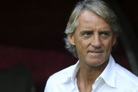 Inter Milan's manager Roberto Mancini looks on prior to a pre-season friendly soccer match against Galatasaray at Turk Telekom Arena in Istanbul, Sunday, Aug. 2, 2015. (AP Photo)