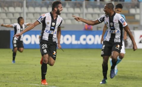 Thiago Maia, of Brazil's Santos, left, celebrates with teammate Jonathan Copete during a Copa Libertadores soccer match against Peru's Sporting Cristal in Lima, Peru, Thursday, March 9, 2017. (AP Photo/Martin Mejia)
