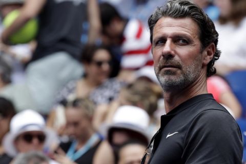 FILE - In this Tuesday, Jan. 15, 2019 file photo, Serena Williams' coach Patrick Mouratoglou watches her first round match against Germany's Tatjana Maria at the Australian Open tennis championships in Melbourne, Australia. With tennis majors on hold and discussions ongoing over whether the U.S. Open or the French Open can even take place later this year, a new digitally friendly tournament starts Saturday in southern France with four Top 10-ranked players involved. (AP Photo/Kin Cheung, File)