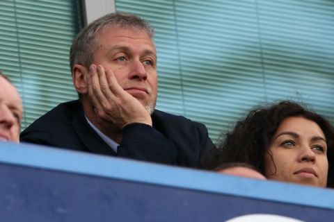 Chelsea FC Russian owner Roman Abramovich watches his side play Arsenal during their English Premier League soccer match between Chelsea and Arsenal at Stamford Bridge stadium in London, Saturday, March,  22, 2014. (AP Photo/Alastair Grant)