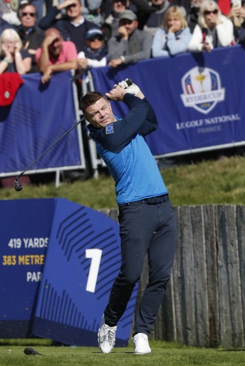 Rugby great Brian O'Driscoll of Europe plays from the 1st tee in the Ryder Cup Celebrity Challenge match at Le Golf National in Saint-Quentin-en-Yvelines, outside Paris, France, Tuesday, Sept. 25, 2018. The 42nd Ryder Cup will be held in France from Sept. 28-30, 2018 at Le Golf National. (AP Photo/Alastair Grant)