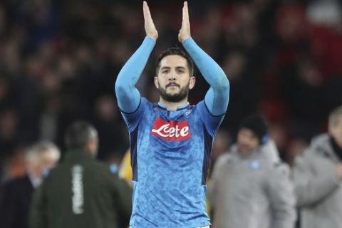 Napoli's Kostas Manolas applauds his side's fans after the Champions League Group E soccer match between Liverpool and Napoli at Anfield stadium in Liverpool, England, Wednesday, Nov. 27, 2019. (AP Photo/Jon Super)