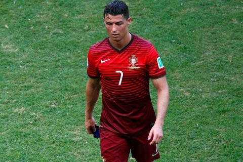 SALVADOR, BRAZIL - JUNE 16:  A dejected Cristiano Ronaldo of Portugal walks off the field after being defeated by Germany 4-0 during the 2014 FIFA World Cup Brazil Group G match between Germany and Portugal at Arena Fonte Nova on June 16, 2014 in Salvador, Brazil.  (Photo by Matthew Lewis/Getty Images)