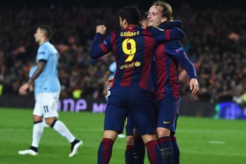 BARCELONA, SPAIN - MARCH 18:  Ivan Rakitic of Barcelona (R) celebrates scoring the opening goal with Neymar and Luis Suarez of Barcelona during the UEFA Champions League Round of 16 second leg match between Barcelona and Manchester City at Camp Nou on March 18, 2015 in Barcelona, Spain.  (Photo by Michael Regan/Getty Images)