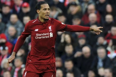 Liverpool's Virgil van Dijk gestures during the English Premier League soccer match between Liverpool and AFC Bournemouth at Anfield stadium in Liverpool, England, Saturday, Feb. 9, 2019. (AP Photo/Rui Vieira)