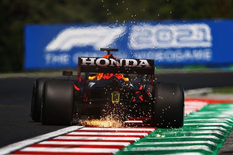 BUDAPEST, HUNGARY - JULY 30: Sparks fly behind Max Verstappen of the Netherlands driving the (33) Red Bull Racing RB16B Honda during practice ahead of the F1 Grand Prix of Hungary at Hungaroring on July 30, 2021 in Budapest, Hungary. (Photo by Bryn Lennon/Getty Images)