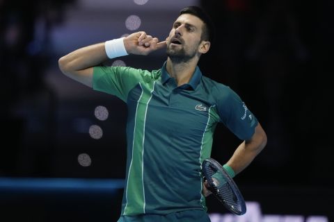 Serbia's Novak Djokovic reacts during his singles semifinal tennis match against Spain's Carlos Alcaraz of the ATP World Tour Finals at the Pala Alpitour, in Turin, Italy, Saturday, Nov. 18, 2023. (AP Photo/Antonio Calanni)