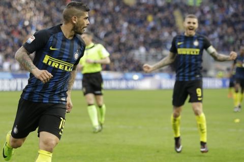 Inter Milan's Ever Banega, left, celebrates with his teammate Mauro Icardi after scoring during the Serie A soccer match between Inter Milan and Atalanta at the San Siro stadium in Milan, Italy, Sunday, March 12, 2017. (AP Photo/Antonio Calanni)