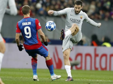 Roma defender Kostas Manolas, right, challenges for the ball with CSKA forward Fedor Chalov during a Group G Champions League soccer match between CSKA Moscow and Roma at the Luzhniki Stadium in Moscow, Wednesday, Nov. 7, 2018. (AP Photo/Pavel Golovkin)