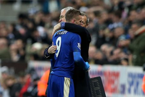Leicester City's Jamie Vardy, right, recieves a hug from manager Claudio Ranieri, left, during the English Premier League soccer match between Newcastle United and Leicester City at St James' Park, Newcastle, England, Saturday, Nov. 21, 2015. (AP Photo/Scott Heppell)