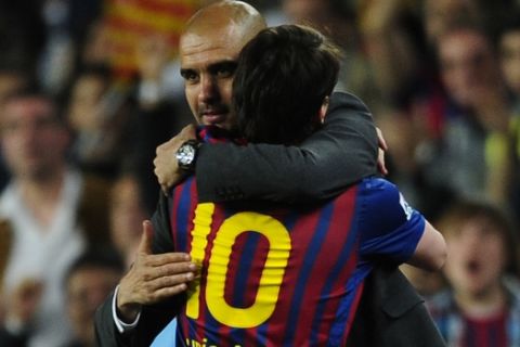 FC Barcelon's coach Pep Guardiola, left, embraces Lionel Messi, from Argentina, after scores during a Spanish La Liga soccer match at the Camp Nou stadium in Barcelona, Spain, Saturday, May 5, 2012. FC Barcelona's coach Pep Guardiola will not continue as coach of the Spanish club after this season and assistant Tito Vilanova will take over. (AP Photo/Manu Fernandez)