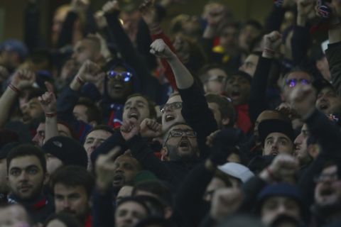 Paris Saint Germain fans chant in support of their team prior to the start of the Champions League round of 16 soccer match between Manchester United and Paris Saint Germain at Old Trafford stadium in Manchester, England, Tuesday, Feb. 12,2019.(AP Photo/Dave Thompson)