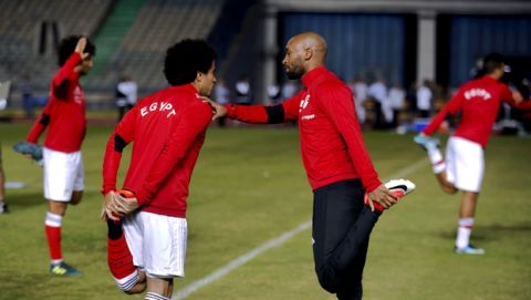 FILE - In this Nov. 6, 2017 photo, Omar Gaber, who plays for Swiss Super League side FC Basel, left, chats with Shikabala, whose real name is Mahmoud Abdel-Razeq, as they warm up with the national team, in Cairo stadium, Egypt. A surprise call-up for international duty has given striker Shikabala a comeback that could even bring on better things -- a place for the 31-year-old journeyman in the Egypt squad traveling to the 2018 World Cup in Russia. (AP Photo/Amr Nabil)