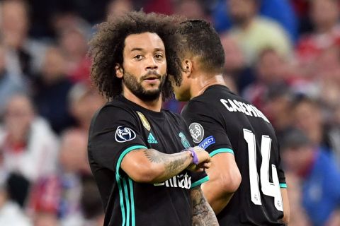 Madrid's Marcelo celebrates after scoring his side's first goal during the soccer Champions League first leg semifinal soccer match between FC Bayern Munich and Real Madrid in Munich, southern Germany, Wednesday, April 25, 2018. (Matthias Balk/dpa via AP)