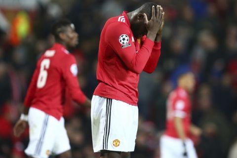 Manchester United's Romelu Lukaku reacts after missing a chance on goal during the Champions League round of 16 second leg soccer match between Manchester United and Sevilla, at Old Trafford in Manchester, England, Tuesday, March 13, 2018. (AP Photo/Dave Thompson)