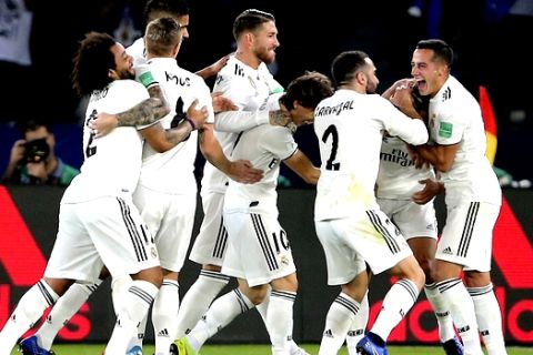 Ream Madrid players celebrate after scoring their second goal during the Club World Cup final soccer match between Real Madrid and Al Ain at Zayed Sport City in Abu Dhabi, United Arab Emirates, Saturday, Dec. 22, 2018. (AP Photo/Kamran Jebreili)
