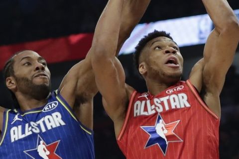 Kawhi Leonard of the Los Angeles Clippers blocks a shot of Giannis Antetokounmpo of the Milwaukee Bucks during the second half of the NBA All-Star basketball game Sunday, Feb. 16, 2020, in Chicago. (AP Photo/Nam Huh)