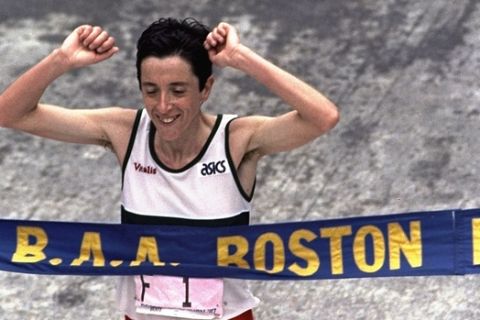 Rosa Mota of Portugal crosses the finish line to win the women's division of the 91st Annual Boston Marathon Monday, April 20, 1987 in the time of 2:25:21. (AP Photo/Peter Southwick)