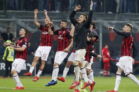 AC Milan players celebrate after winning the Serie A soccer match between AC Milan and Empoli at the San Siro stadium, in Milan, Italy, Friday, Feb. 22, 2019. AC Milan won 3-0. (AP Photo/Antonio Calanni)