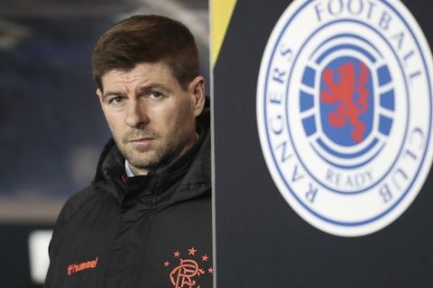 Rangers' manager Steven Gerrard stands prior to the start of the Europa League group G soccer match between Rangers and Young Boys at the Ibrox stadium in Glasgow, Scotland, Thursday, Dec. 12, 2019. (AP Photo/Scott Heppell)