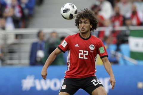 Egypt's Amr Warda watches the ball during the group A match between Egypt and Uruguay at the 2018 soccer World Cup in the Yekaterinburg Arena in Yekaterinburg, Russia, Friday, June 15, 2018. (AP Photo/Mark Baker)