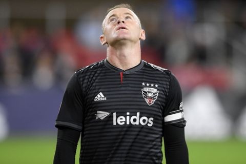 D.C. United forward Wayne Rooney (9) stands on the field during the first half of an MLS playoff soccer match against the Columbus Crew SC, Thursday, Nov. 1, 2018, in Washington. (AP Photo/Nick Wass)