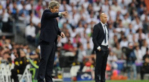 "MADRID, SPAIN - MAY 04:  Manuel Pellegrini the manager of Manchester City and Zinedine Zidane the head coach of Real Madrid look on during the UEFA Champions League semi final, second leg match between Real Madrid and Manchester City FC at Estadio Santiago Bernabeu on May 4, 2016 in Madrid, Spain.  (Photo by David Ramos/Getty Images )"
