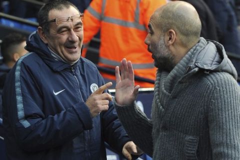 Chelsea manager Maurizio Sarri, left, and Manchester City manager Pep Guardiola ahead of the English Premier League soccer match between Manchester City and Chelsea at Etihad stadium in Manchester, England, Sunday, Feb. 10, 2019. (AP Photo/Rui Vieira)