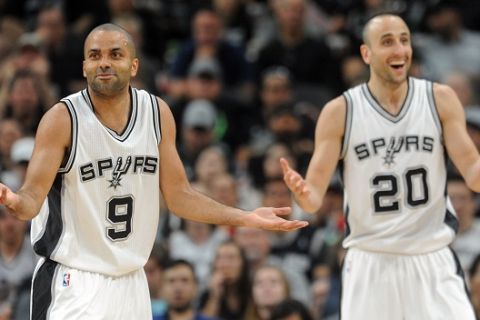 San Antonio Spurs guards Tony Parker, right, and Manu Ginobili react to a foul call against the Spurs during the first half of an NBA basketball game against the New Orleans Pelicans, Wednesday, March 30, 2016 in San Antonio. The Spurs won 100-92. (AP Photo/Bahram Mark Sobhani)