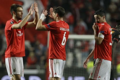 Benfica players celebrate end of the Europa League round of 32, second leg, soccer match between Benfica and Galatasaray at the Luz stadium in Lisbon, Thursday, Feb. 21, 2019. (AP Photo/Armando Franca)