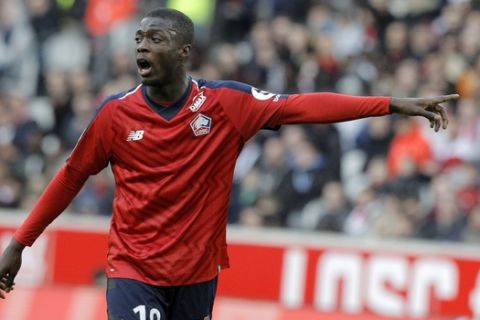 Lille's Nicolas Pepe gestures during his League One soccer match match Lille and Montpellier at the Lille Metropole stadium, in Villeneuve d'Ascq, northern France, Saturday, Feb. 17, 2019. (AP Photo/Michel Spingler)