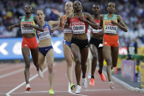 Kenya's Hellen Onsando Obiri, center, wins a Women's 5000m heat during the World Athletics Championships in London, Thursday, Aug. 10, 2017. (AP Photo/David J. Phillip)