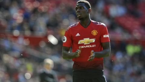 Manchester United's Paul Pogba applauds during the English Premier League soccer match between Manchester United and Cardiff City at Old Trafford in Manchester, England, Sunday, May 12, 2019. (AP Photo/Rui Vieira)