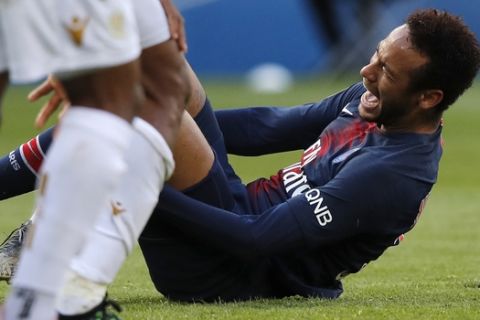 PSG's Neymar reacts after falling during the French League One soccer match between Paris Saint-Germain and Nice at the Parc des Princes stadium in Paris, France, Saturday, May 4, 2019. (AP Photo/Christophe Ena)